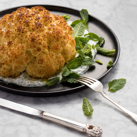 Whole Roasted Cauliflower with Herbed Greek Yogurt and Mint