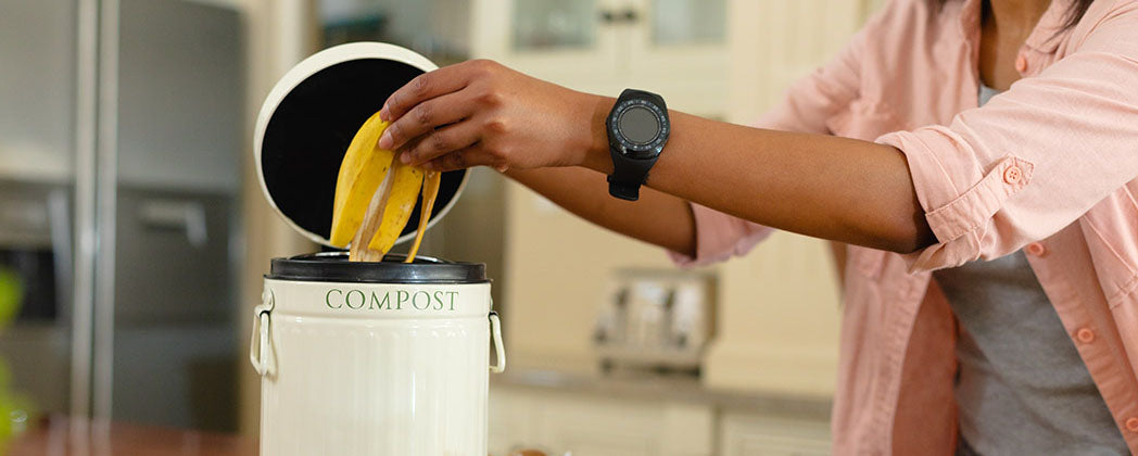 woman using composter